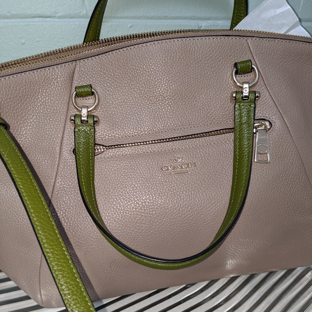 Coach crossbody bag in tan and green.